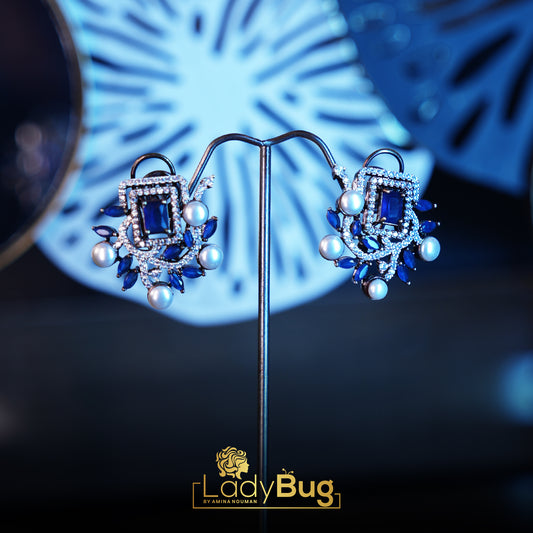 Rhodium-plated studs with sapphire stone and white pearls