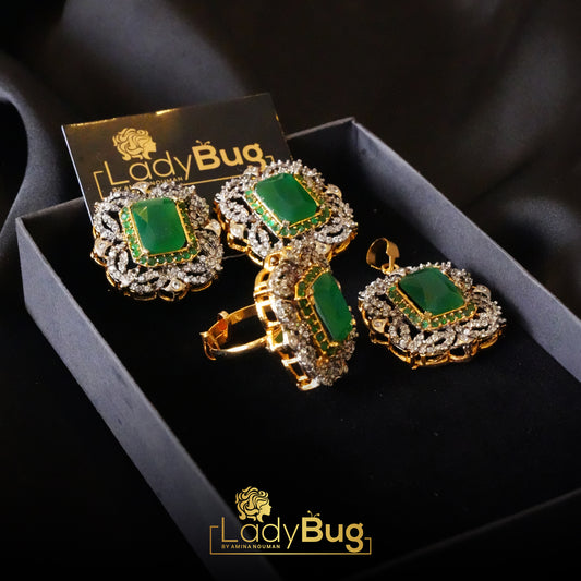 gold-plated diamond cut pendant set with emerald stones